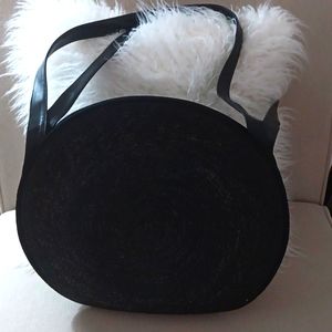 Lancome Paris black round rattan bag